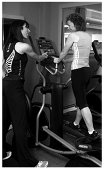 Diane training a client in the gym